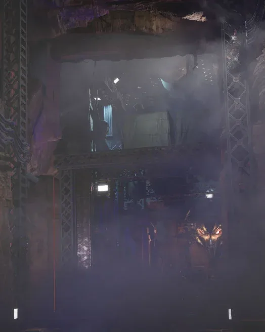 Fog over the lab entrance, the emblem glowing beyond